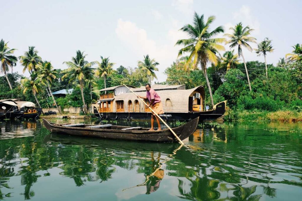 What to see do in Kumarakom? 10 tourist attractions in Kumarakom — Kumarakom Bird Sanctuary aerial view with Vembanad Lake at dawn